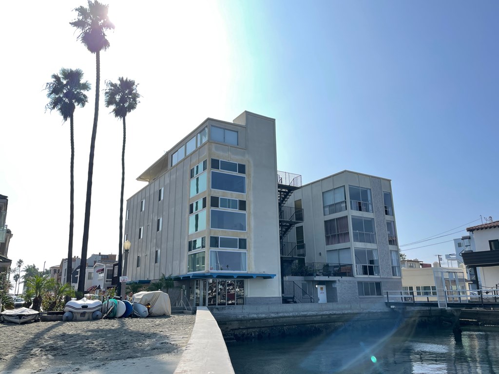 A modern building with a palm tree in front of it.