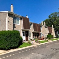 a row of houses on the side of a street