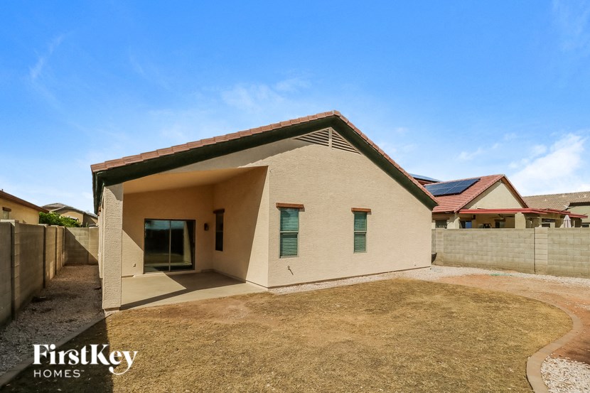 a small house with a yard in front of it