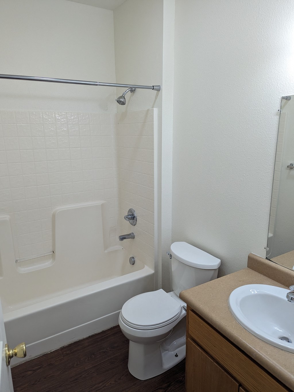 an empty bathroom with a toilet sink and tub