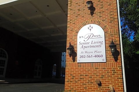 a sign on the side of a brick building