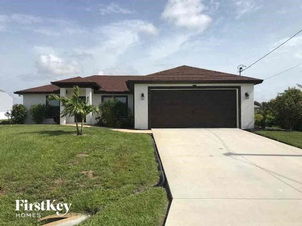 a house with a driveway and a garage door