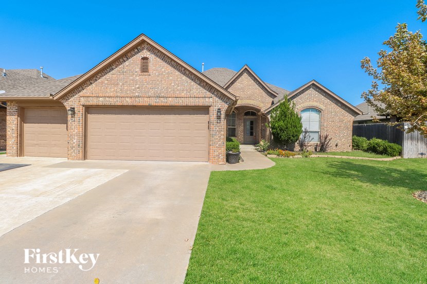 a house with a driveway and a garage door