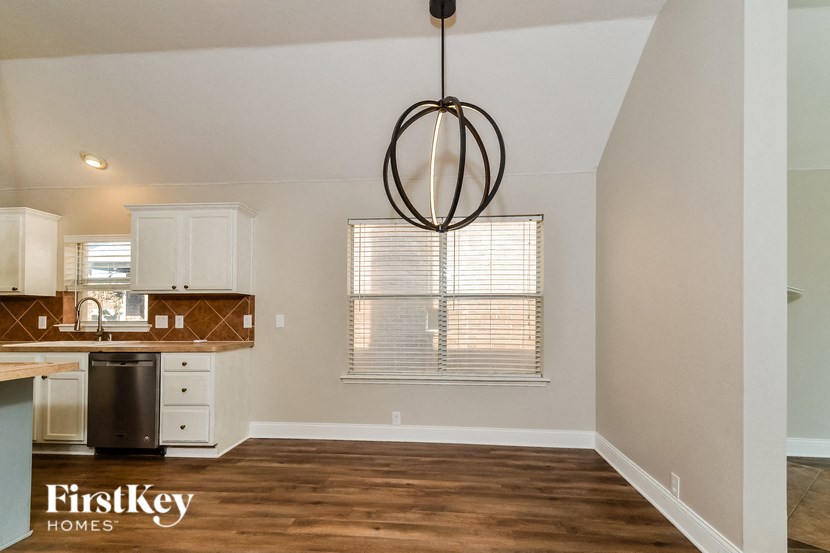 A kitchen with a FirstKey Homes logo.