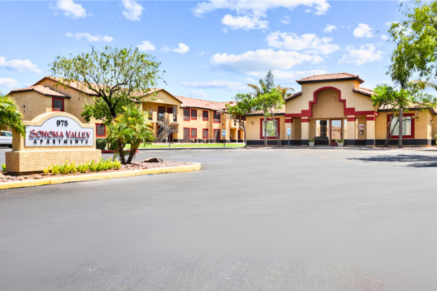 an empty parking lot in front of a building with a sign for the saviour