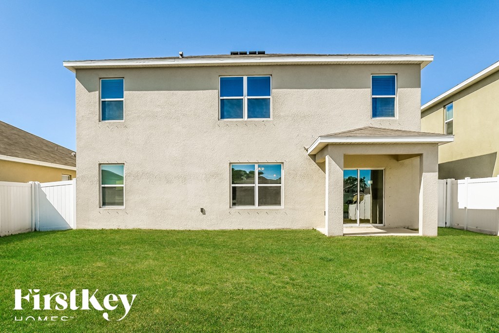 a white house with a lawn in front of it