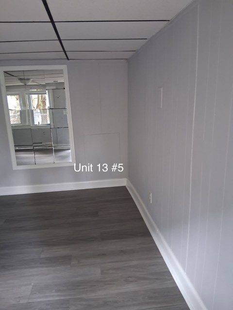 A room with a window and a ladder in it.