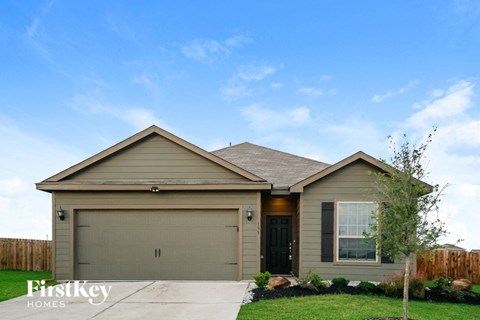 A house with a brown garage door is for sale.