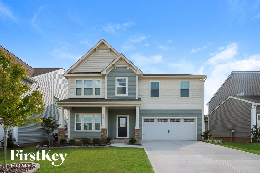 a suburban house with a white garage door