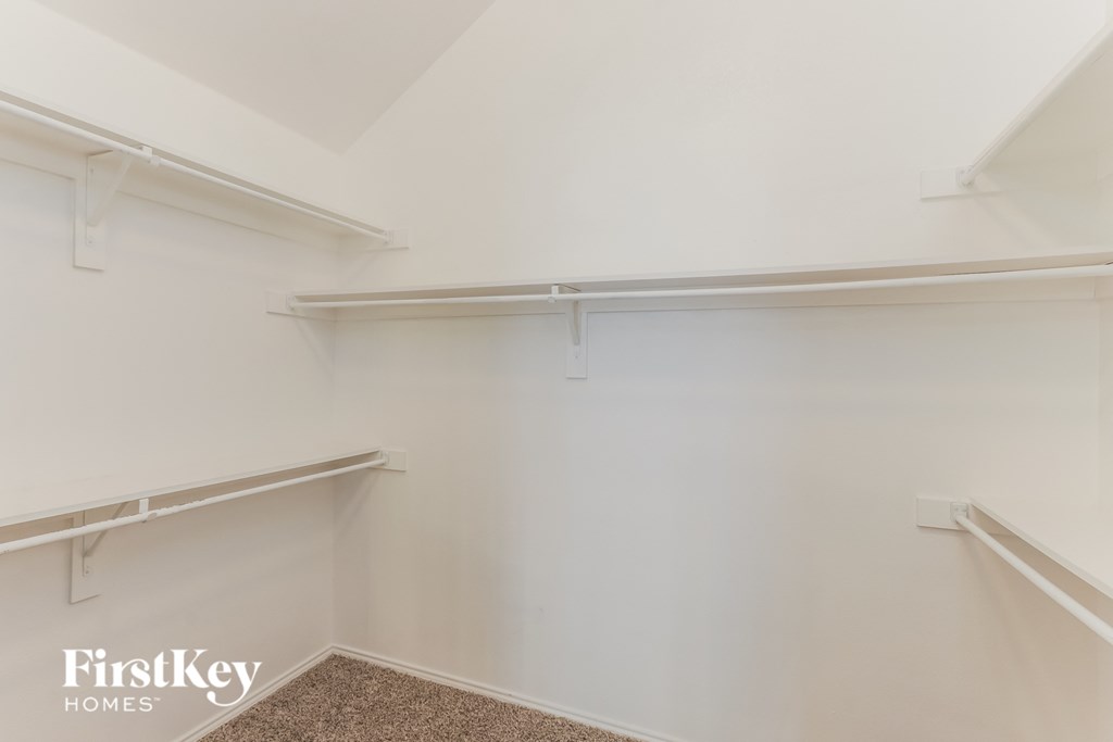 A white wall with a FirstKey Homes logo.