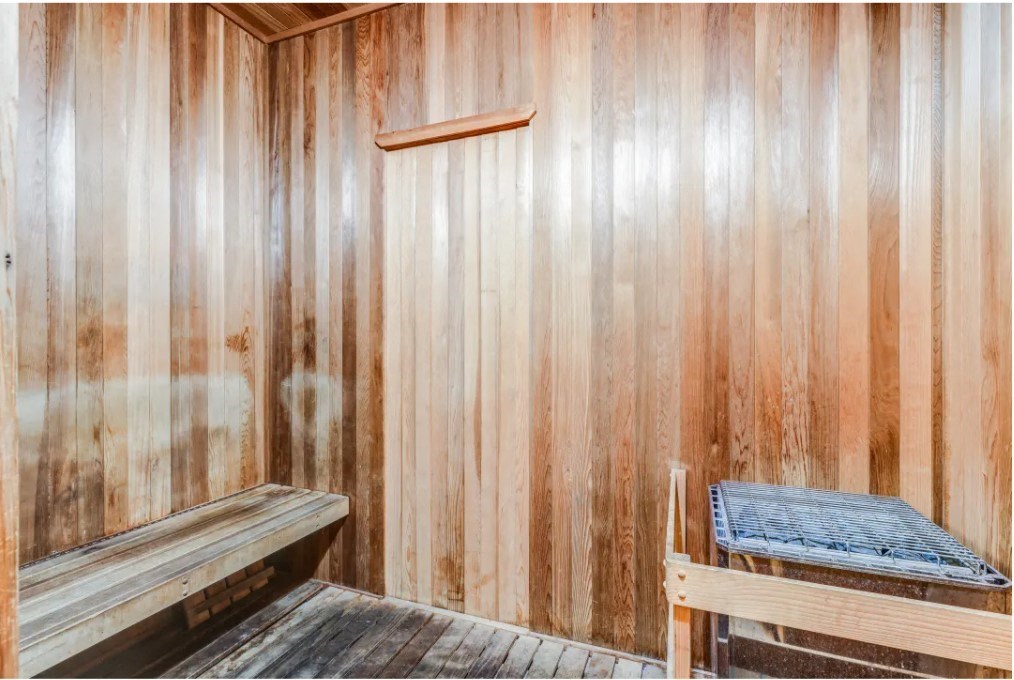 a wooden sauna with two benches in it