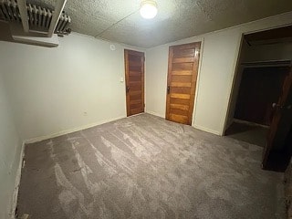 A room with a wooden door and a ceiling fan.