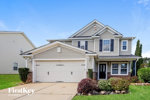 a suburban house with a white garage door