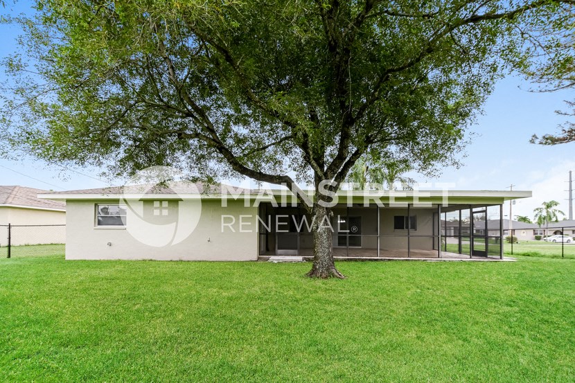 a house with a tree in front of it