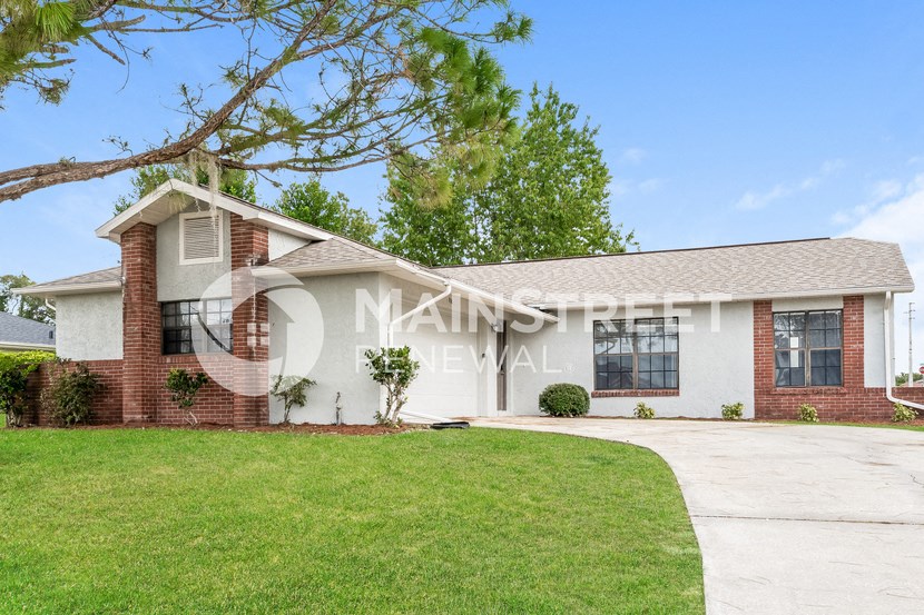 a house with a lawn in front of it