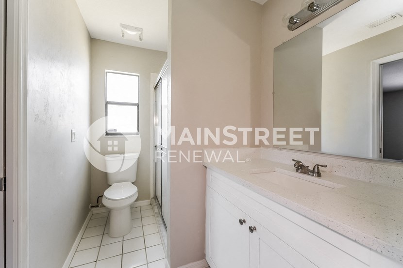a renovated bathroom with a toilet and a sink