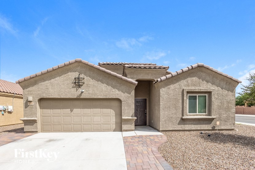 A house with a garage door and a window.