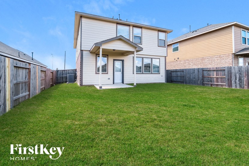 A house with a lawn in front of it is for sale.