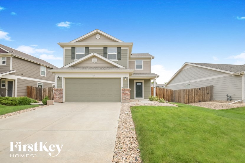 A house with a garage is for sale by FirstKey Homes.