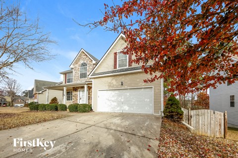 A house with a garage is for sale by FirstKey Homes.