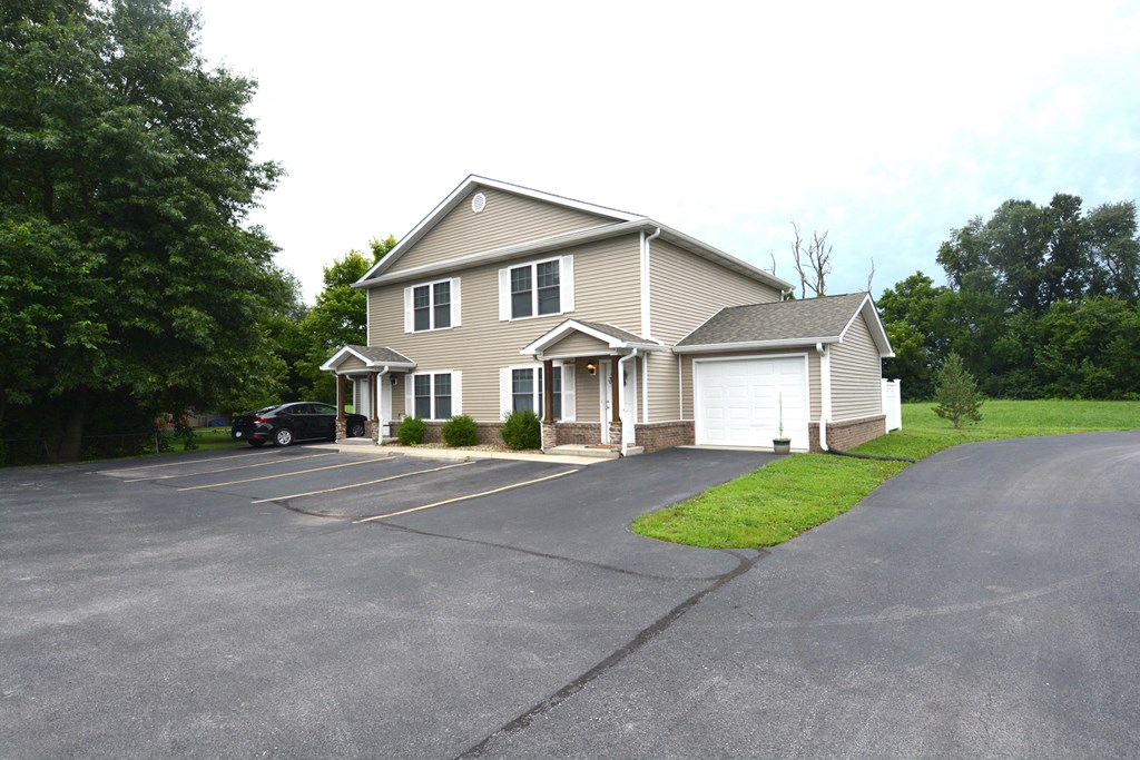 a large driveway in front of a house