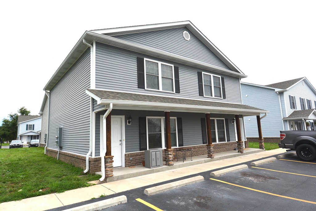 a house with a truck parked in front of it