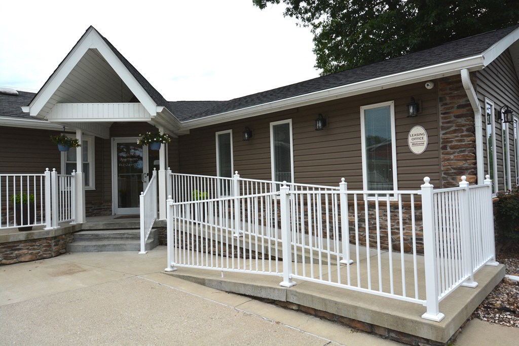 a house with a white fence in front of it