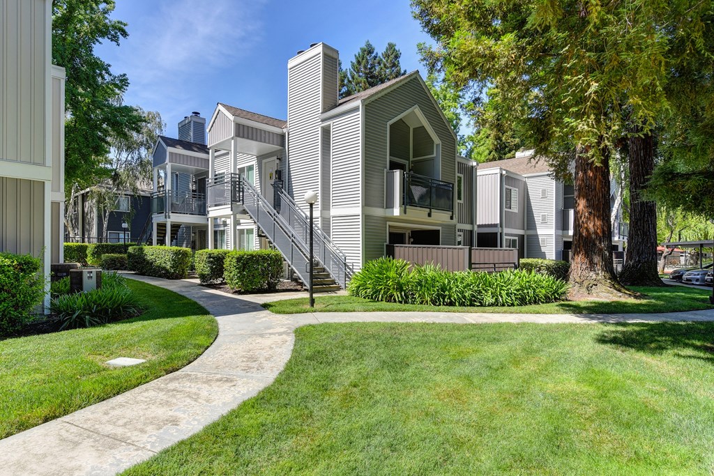 Building Exterior with Walkway, Grass and Trees at Rush River Apartments, Sacramento, CA, 95831
