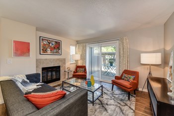 Living Room and Entryway withWood Inspired Floors,  Orange Chair, Hardwood Inspired Floor, Gray Sofa, Black/White Rug  - Photo Gallery 3