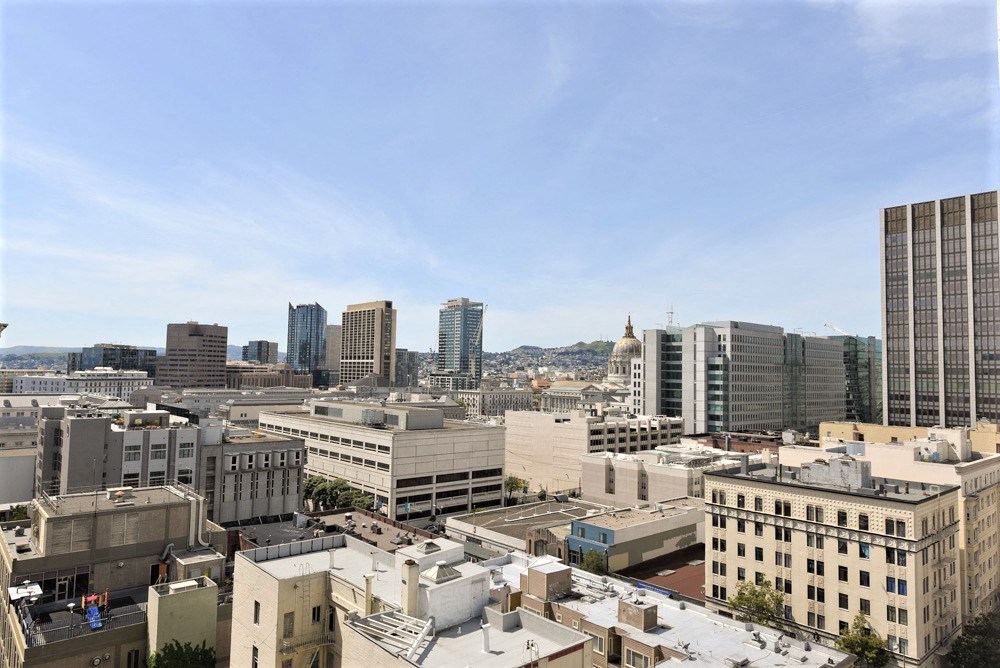 a view of the city from the roof of a building