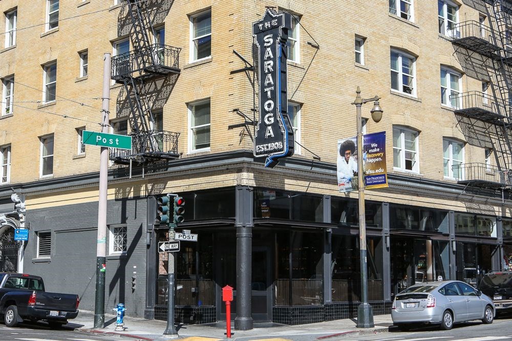 a building with a sign on the side of a street