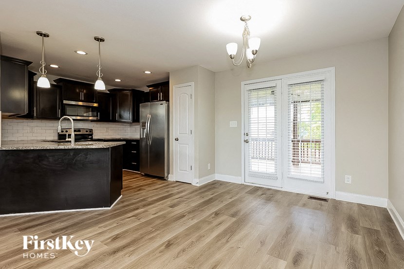 the kitchen and living room of an open floor plan