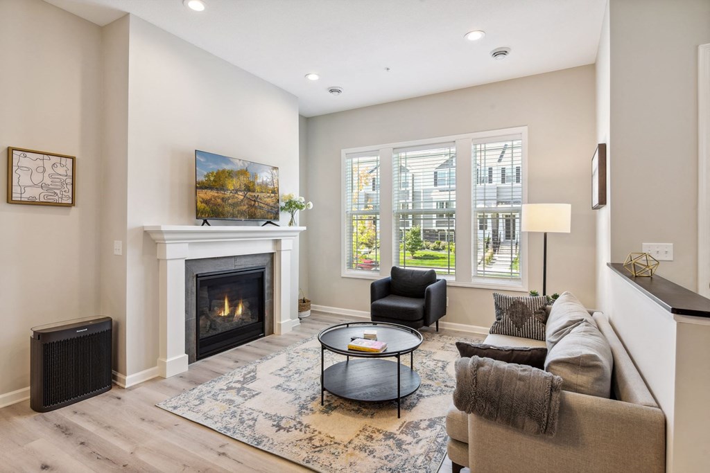 a living room with a couch and a fireplace