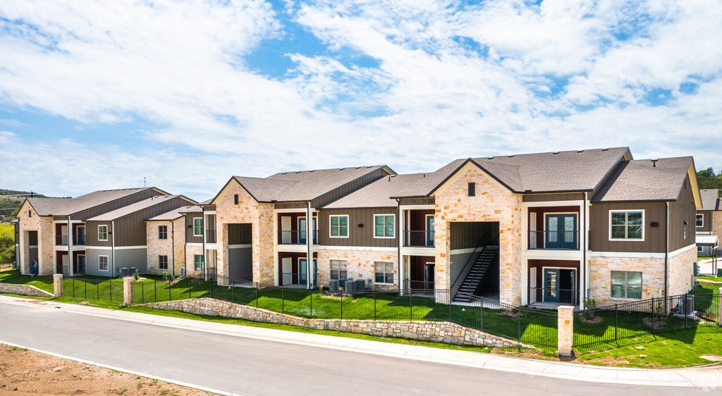 a row of houses on the side of a street