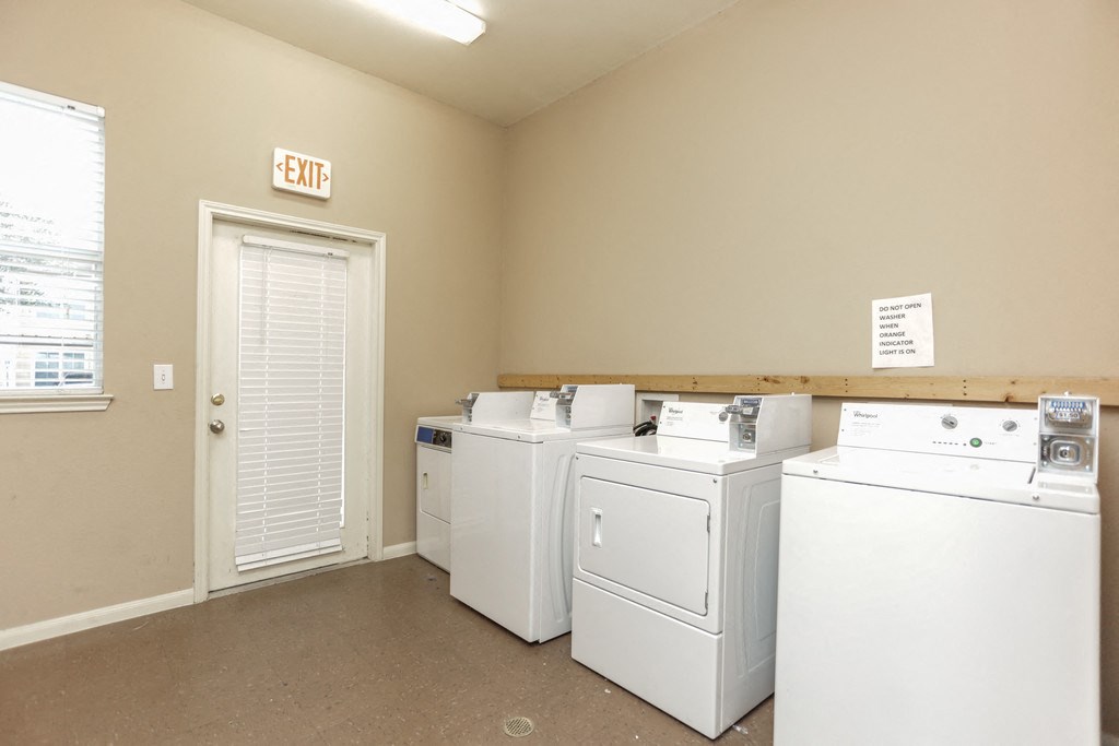 the laundry room is equipped with washes and dryers
