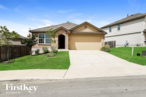 a house with a driveway and a garage door