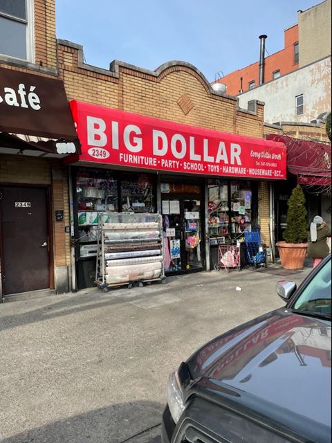 a big dollar store on the side of a street