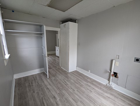 a bedroom with a closet and a sliding door