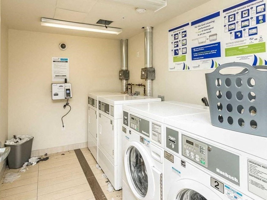 a washing machine and other laundry machines in a laundromat