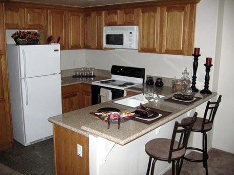 a kitchen with a counter top and a refrigerator
