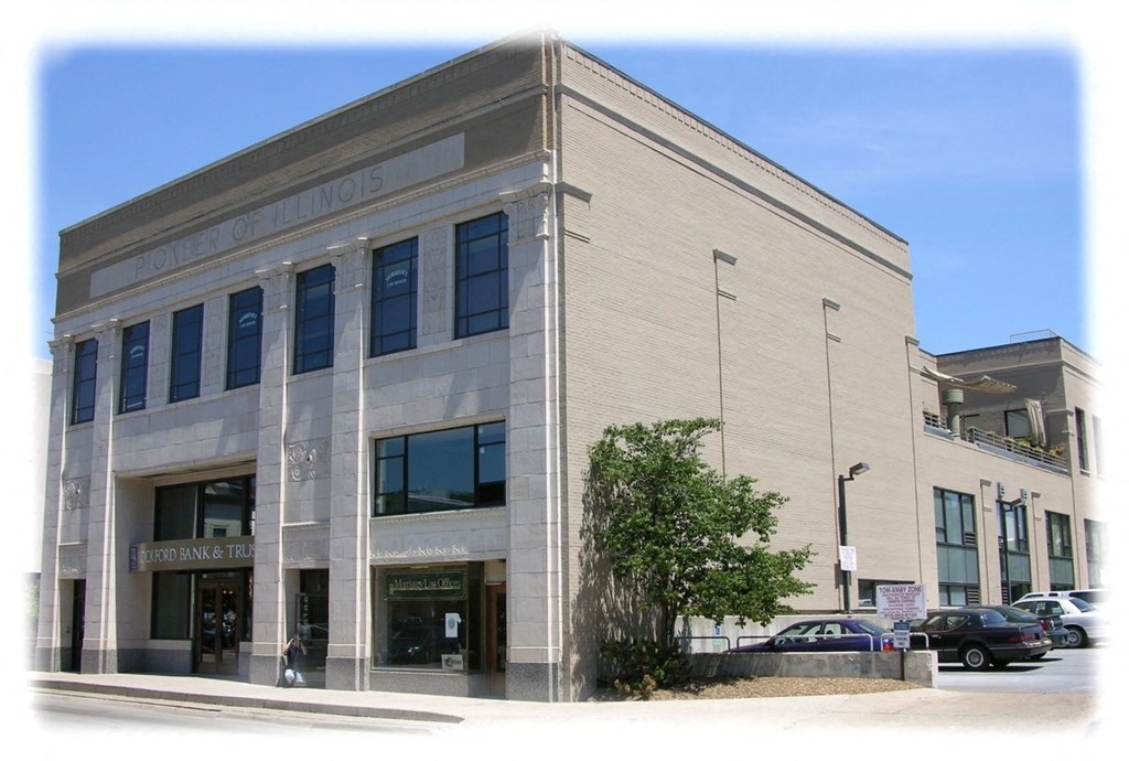 a large building with cars parked outside of it