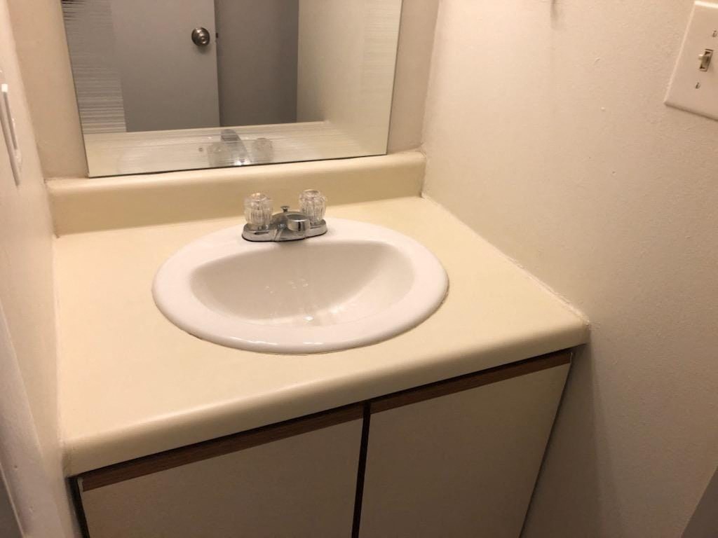 a bathroom with a sink and a mirror