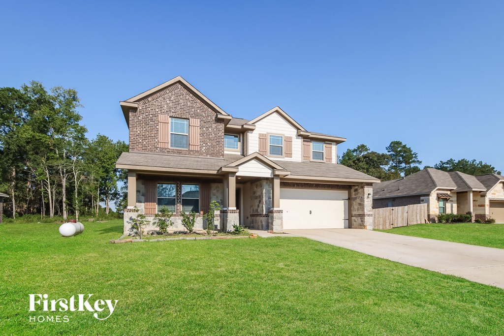 A large house with a garage is shown in the image.