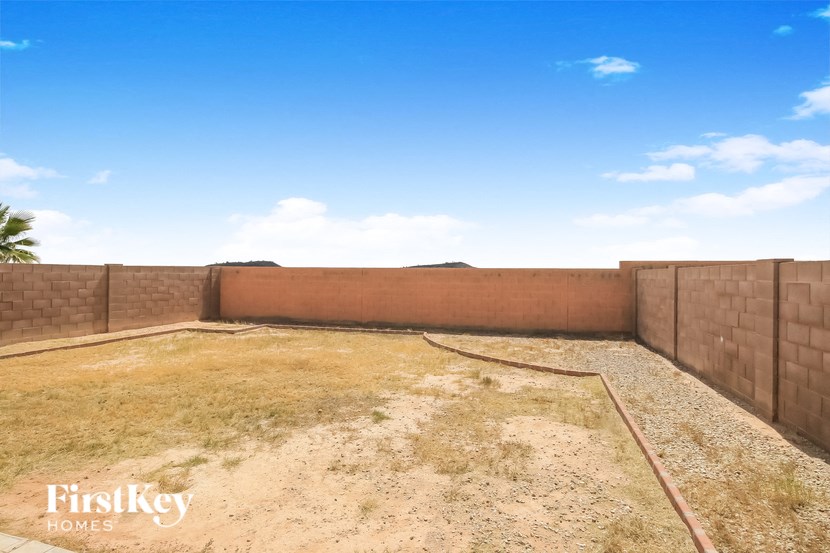 the backyard of the house has no grass