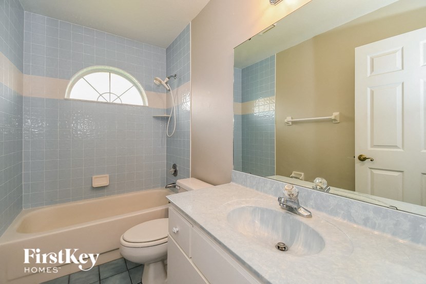 a bathroom with a sink and a tub and a toilet