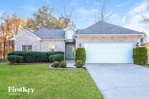 A house with a garage is for sale by FirstKey Homes.