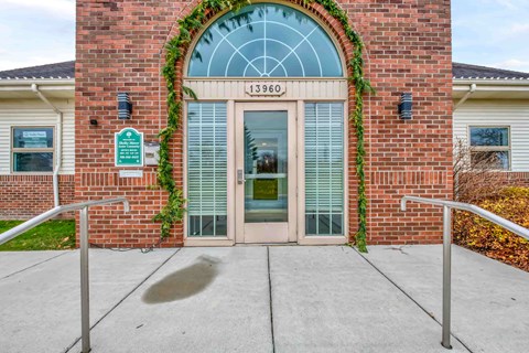 The front of a building with a glass window and a door.