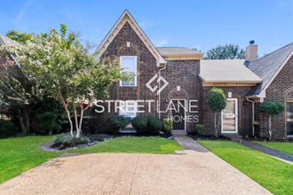 the front of a brick house with the street lane homes logo on it