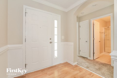 a bedroom with two closets and a door to a hallway