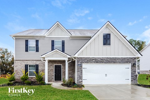 a home with a white house and a white garage door